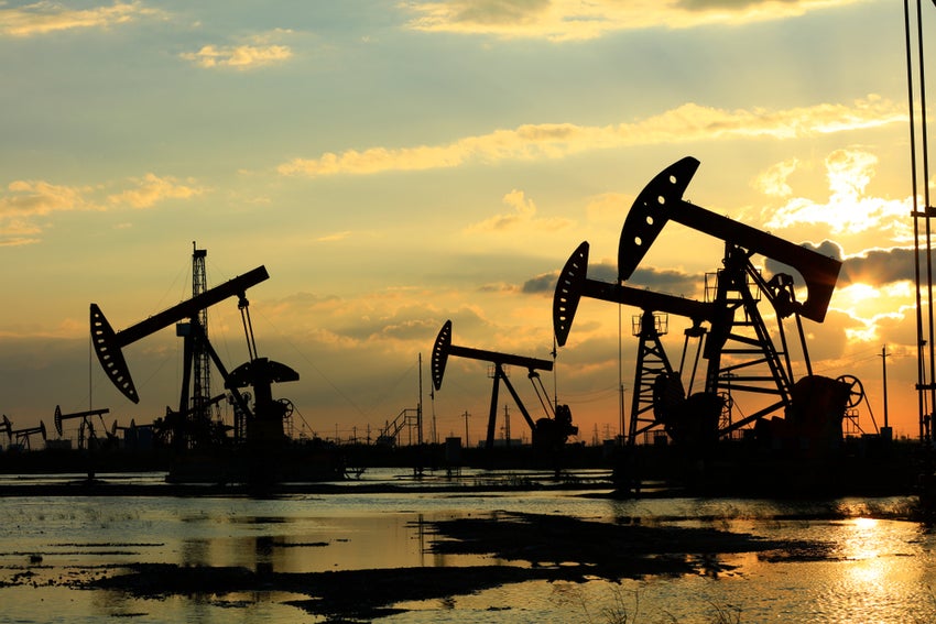 Oil,Field,Site,,In,The,Evening,,Oil,Pumps,Are,Running