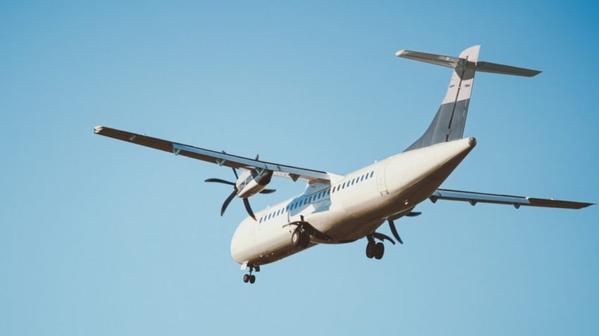 ATR 72 airplane in the clear blue sky