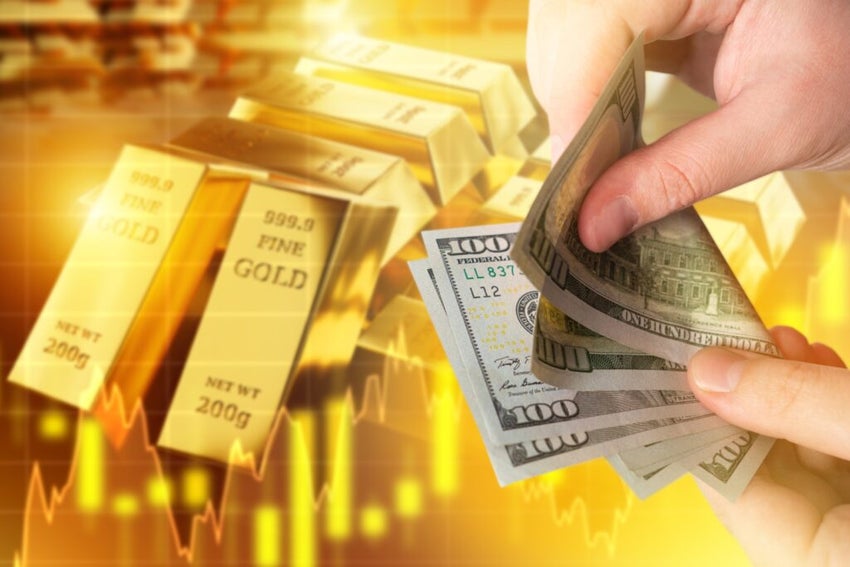 Rising,Gold,Prices.,Money,In,Hands,Of,Man.,Gold,Bars