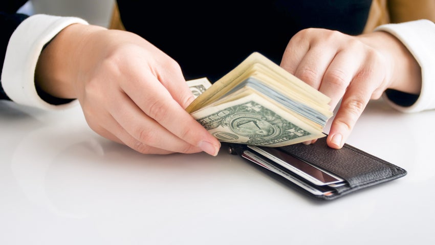 Closeup,Image,Of,Young,Rich,Woman,Trying,To,Put,Big