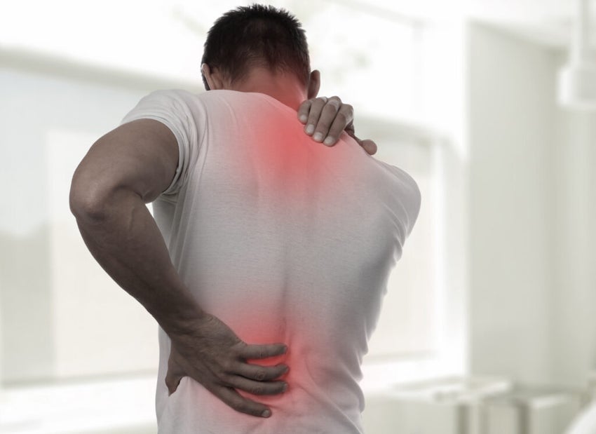 Muscular,Man,Suffering,From,Back,And,Neck,Pain.,Incorrect,Sitting