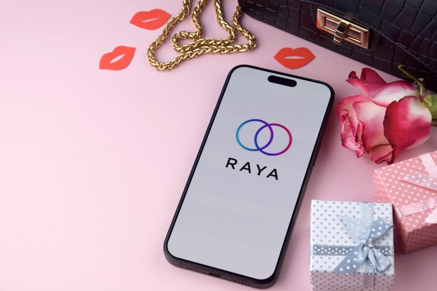 Cell phone witu Raya dating App with roses, gifts and red lips