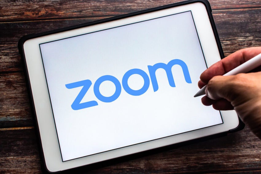 An iPad with the Zoom logo