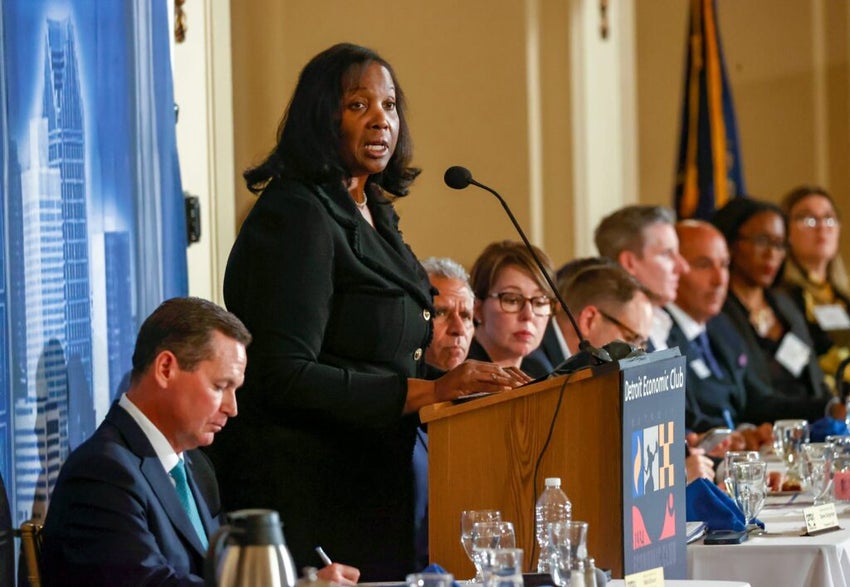 Former Fed official Lisa Cook speaking at a podium
