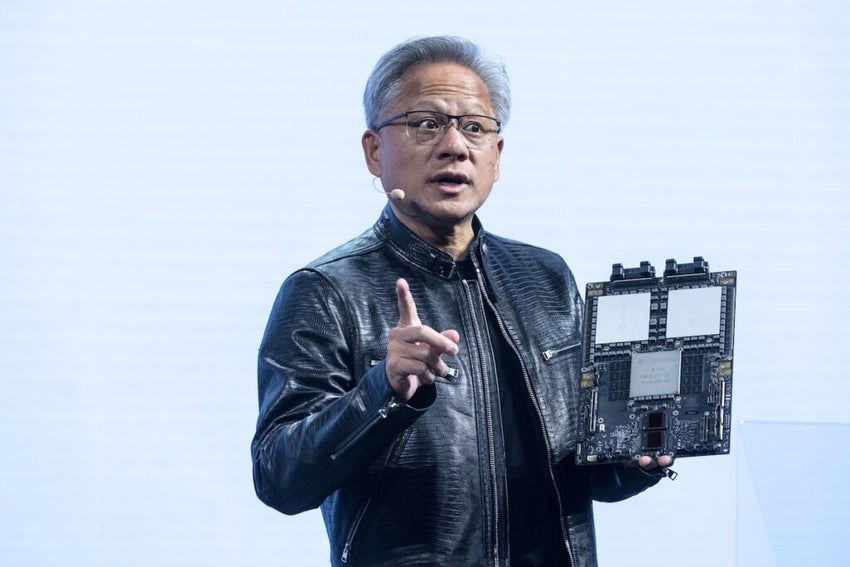 Jensen Huang with a new motherboard during Charles Liang ,Supermicro CEO keynote