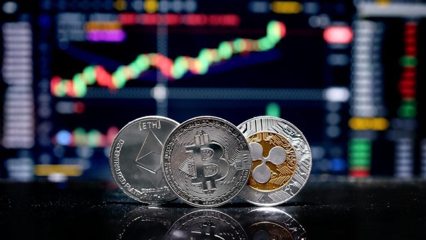 Coin,Bitcoin,,Eth,And,Xrp,On,Background,Cryptocurrency,Trading,Chart