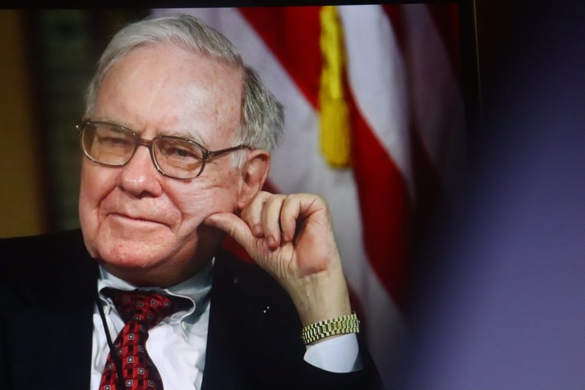 Warren Buffett with US flag behind him