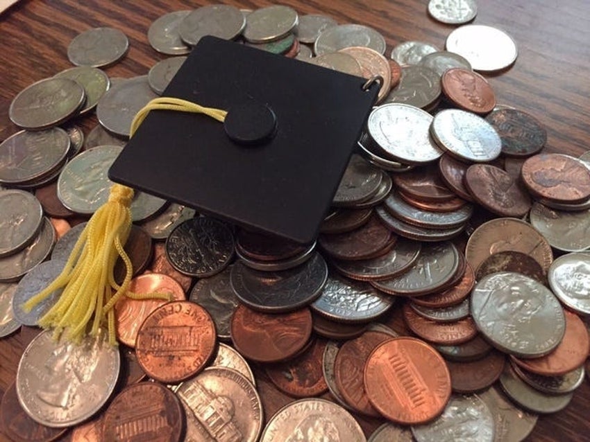 mortarboard on pile of coins