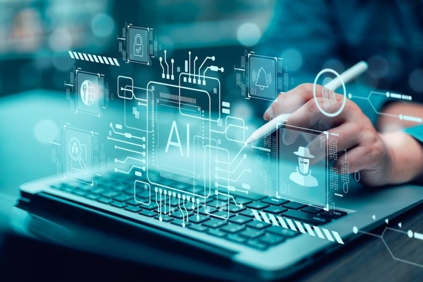 Person using laptop with AI holographic interface