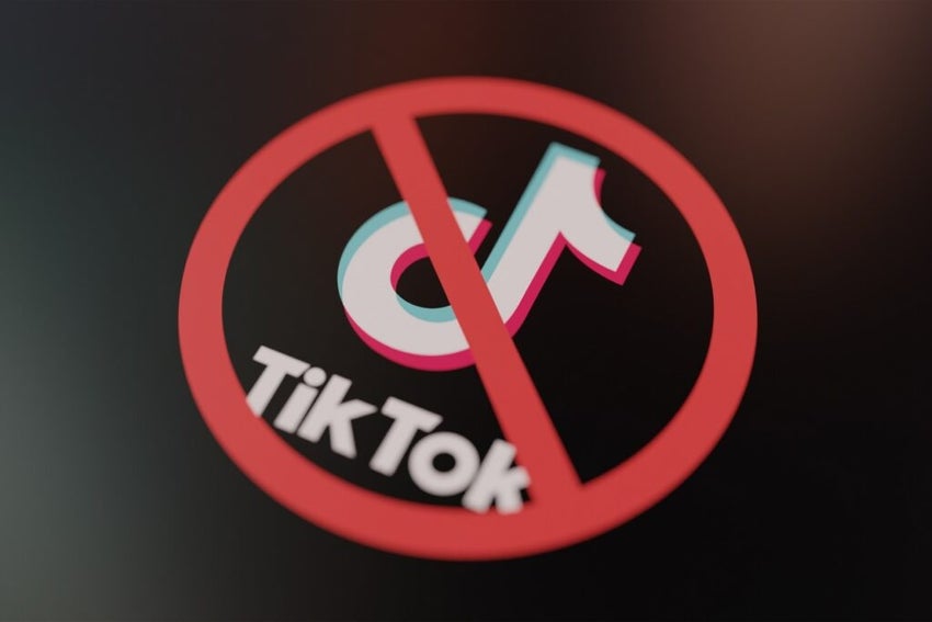 TikTok logo crossed out with red Ban sign displayed on lcd screen