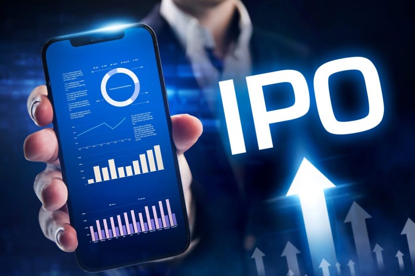 man holding mobile phone with trading app for IPO