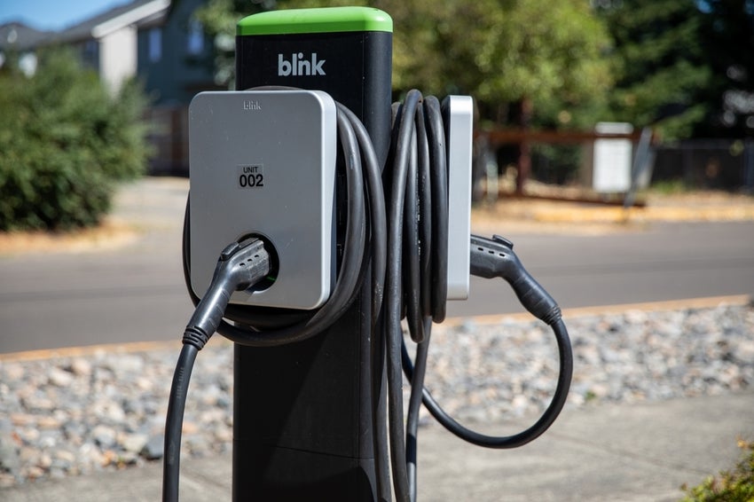 Blink charging station with cables in residential area.