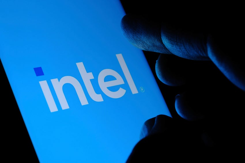 Intel logo on blue screen with hand silhouette
