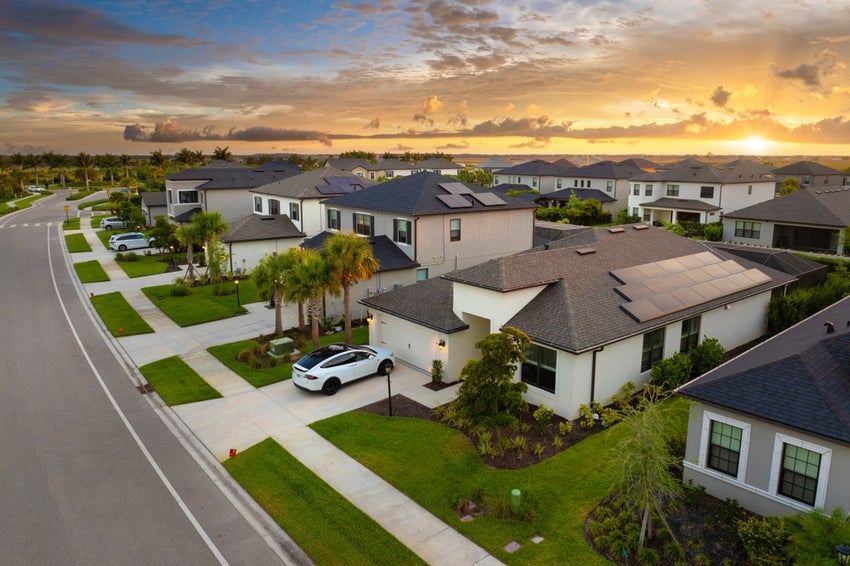 Homes with sunset in background