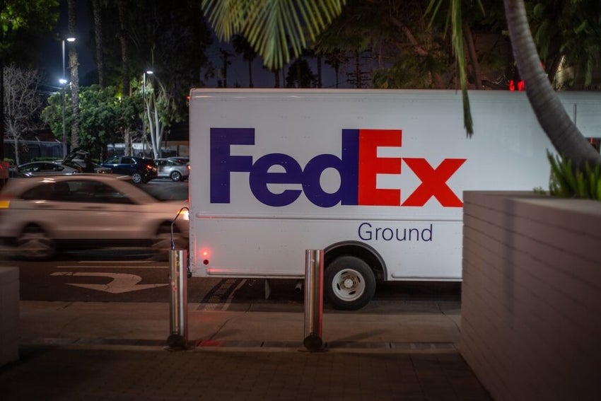 FedEx Ground truck parked on street at night