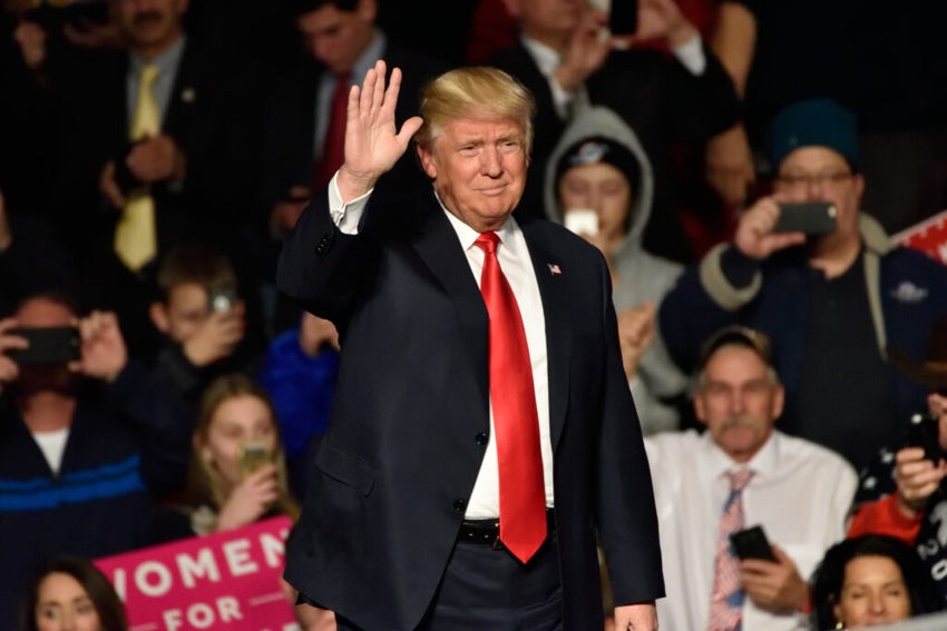 Donald Trump waving to a crowd