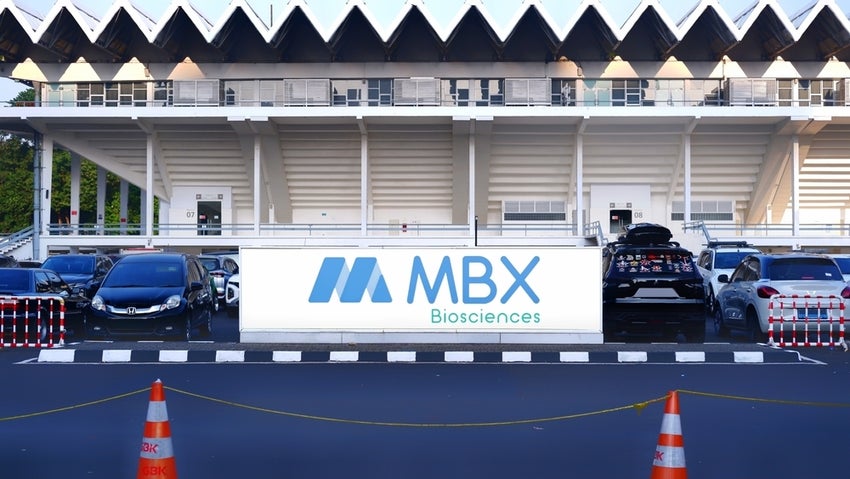 Parking lot with MBX Biosciences sign in foreground.