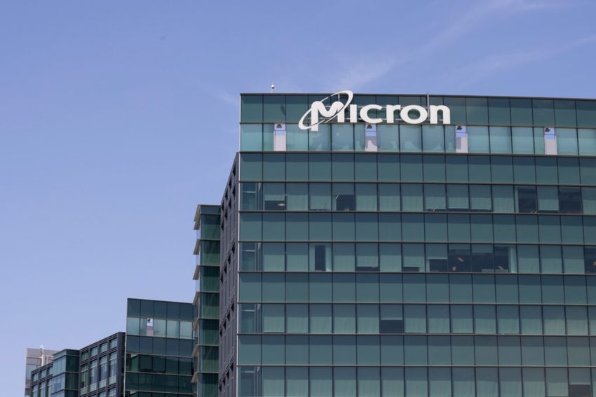 Micron building with logo at the top, sky in background