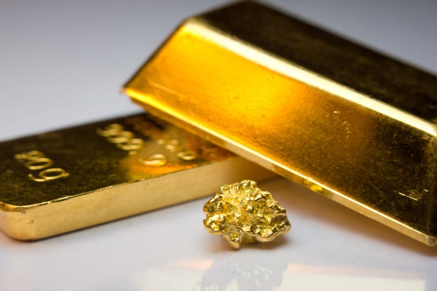 Gold bars on white table