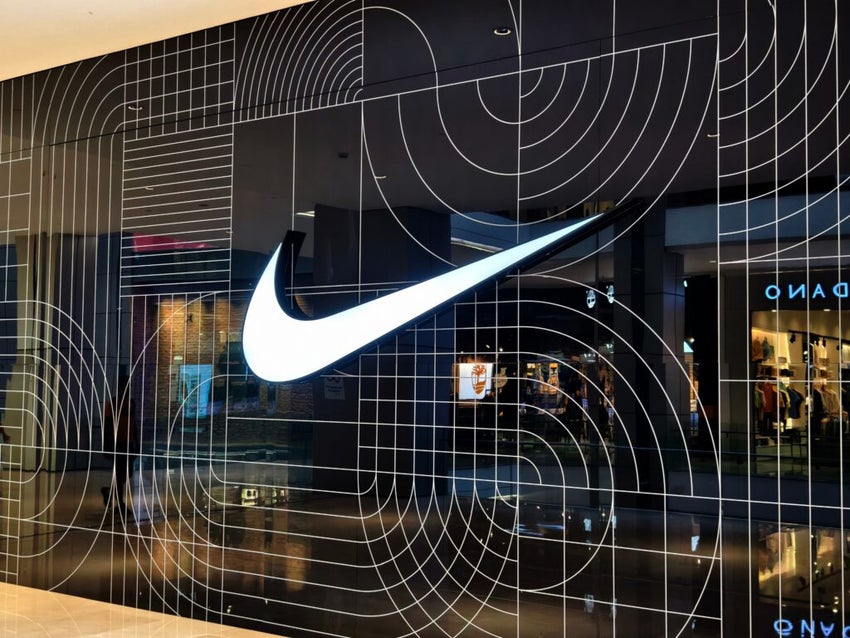 Nike logo on geometric patterned storefront wall