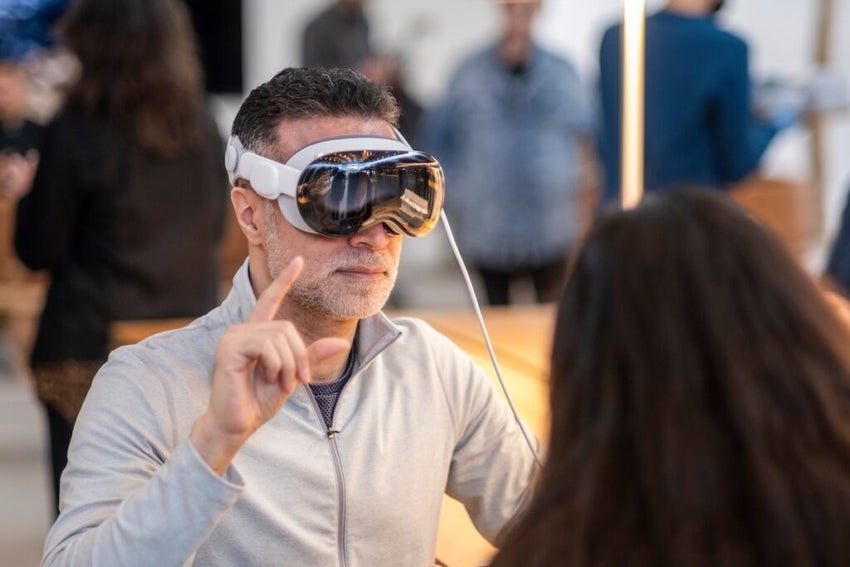 A customer tries the Vision Pro at Apple The Grove in Los Angeles, California