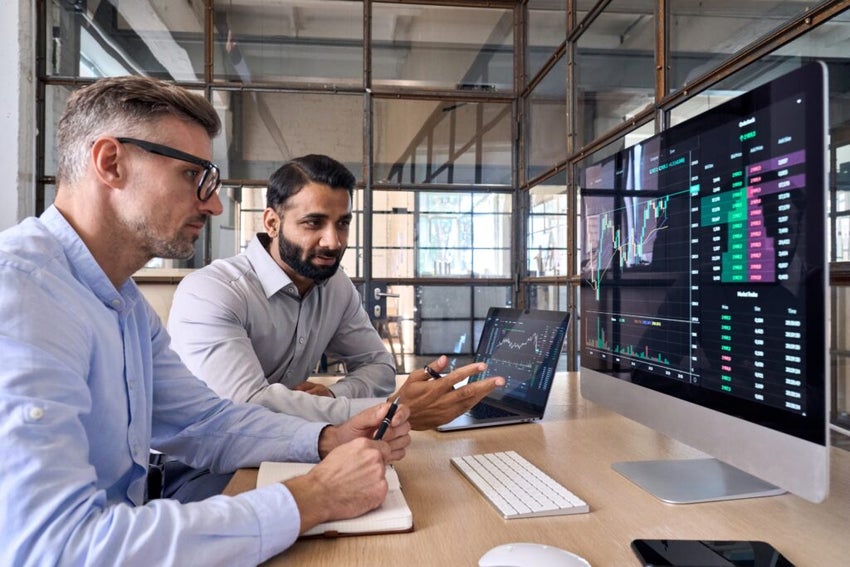 analysts looking at screen