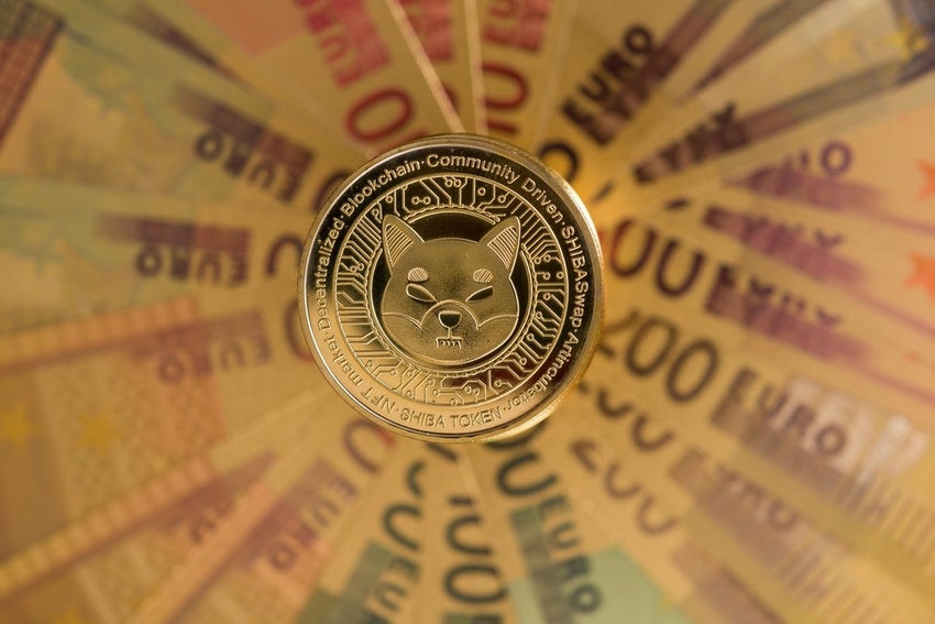 SHIB token against background of currency