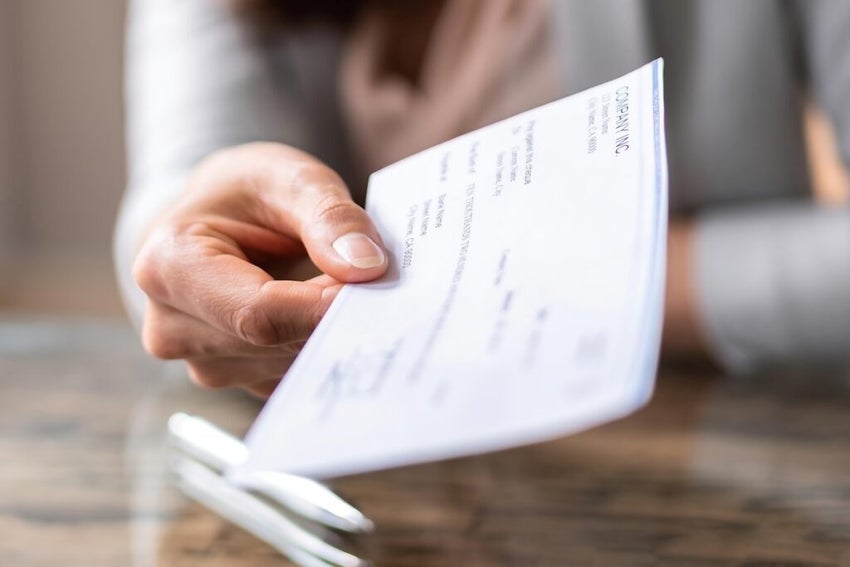 Paycheck in hand for employee