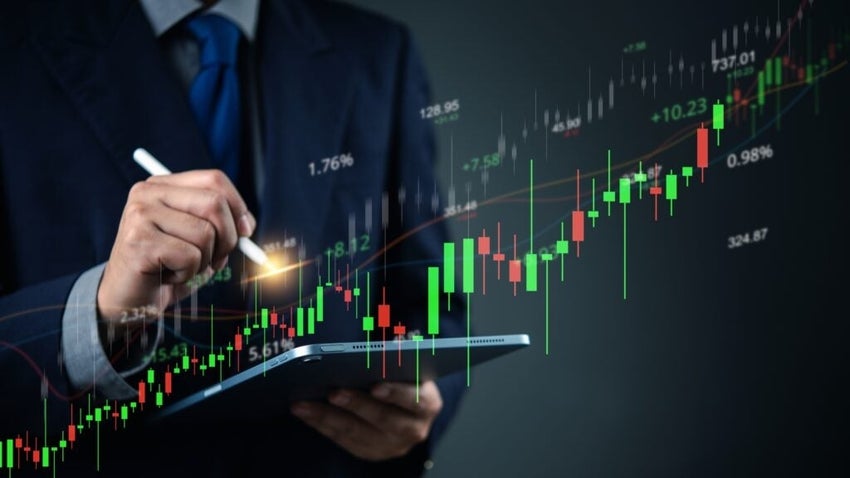 Person analyzing stock market data on tablet.