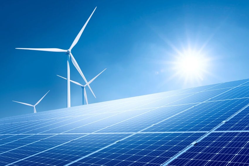 Solar panels with wind turbine on blue sky