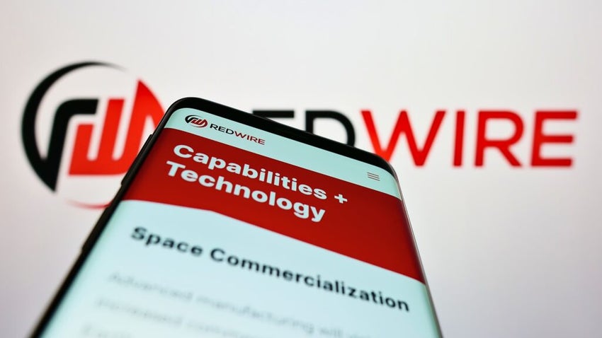 Redwire logo on smartphone with another logo in the background.