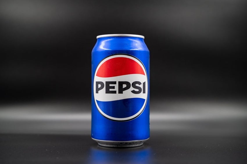 Blue Pepsi can on dark background.