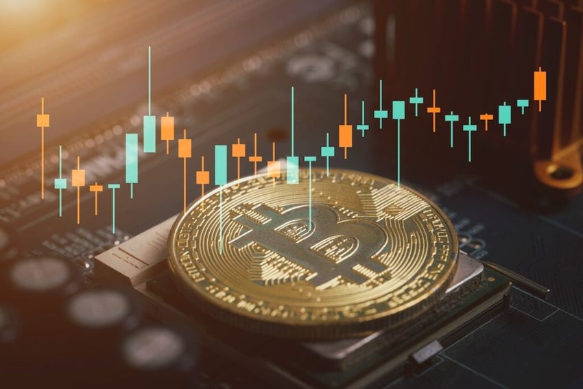 Bitcoin gold coin and defocused chart background