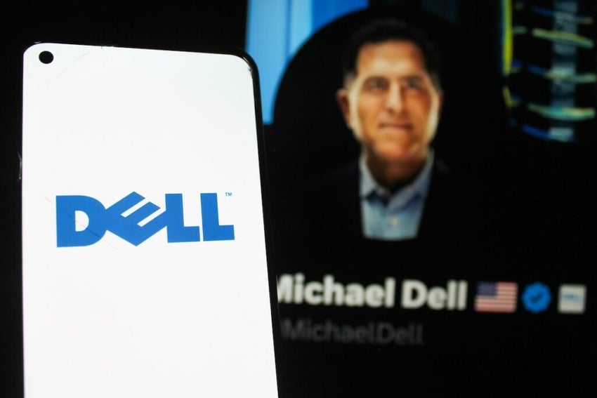 Dell Technologies logo displayed on a smartphone screen. With Dell CEO Michael Dell X profile photo in the background.