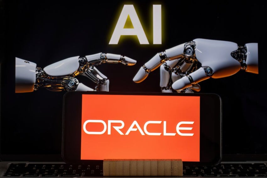 Oracle logo displayed on a smartphone screen, held in the background by a humanoid robotic hands. In the foreground, the words Artificial Intelligence
