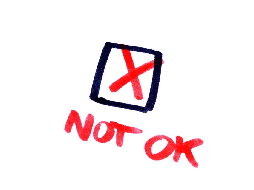 words "not ok" with a red marked check box above