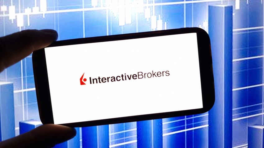 Interactive Brokers log on smartphone in front of a blue screen