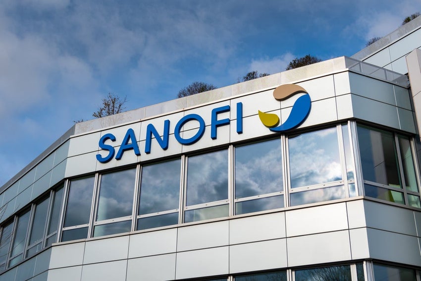 Sanofi logo on modern glass building exterior