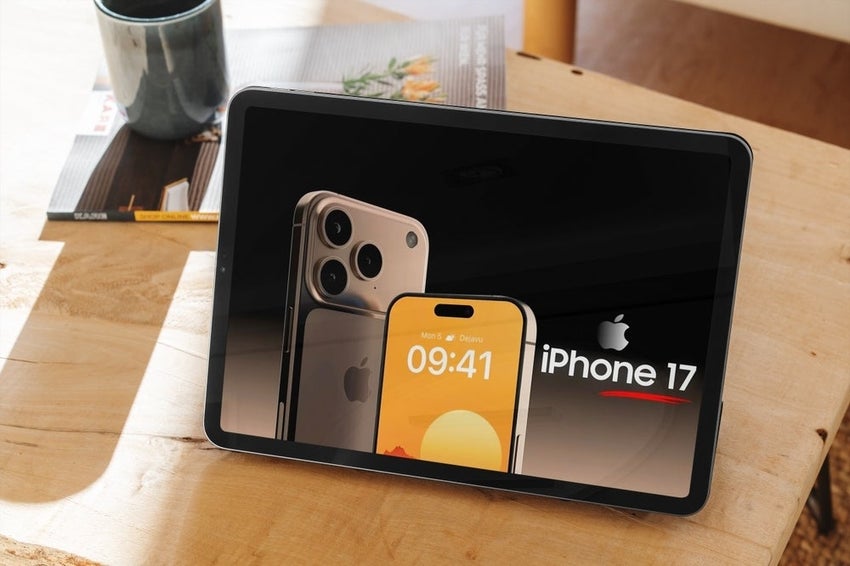 Tablet displaying an advertisement for the iPhone 17 on a wooden table.
