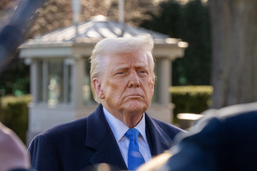 President Donald Trump stops to speak with media before boarding Marine 1