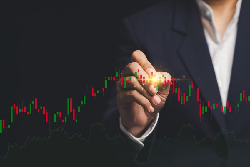 A businessman in a suit interacts with a digital stock market chart,representing financial analysis and investment strategies. Ideal for business and finance themes.