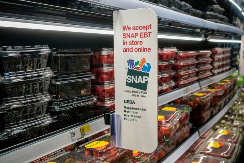 A sign in a store in New York announces that the store accepts SNAP (Supplemental Nutrition Assistance Program) formerly known as EBT
