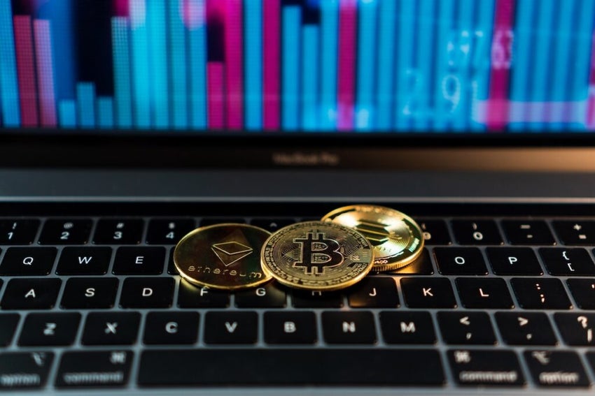 Closeup of golden Bitcoin, Ethereum and Solana coins