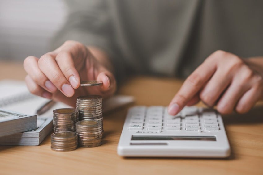 stack of coins and calculator