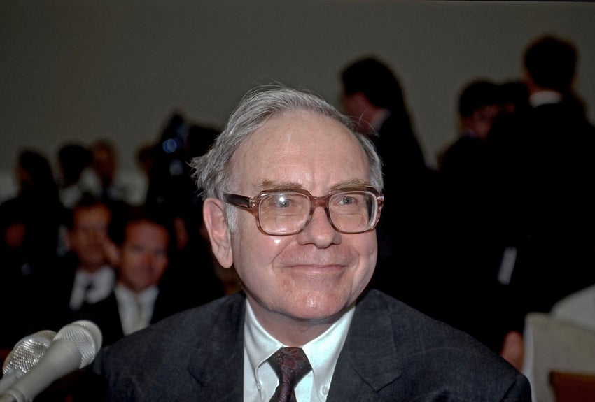 Warren Buffett poses for a photo