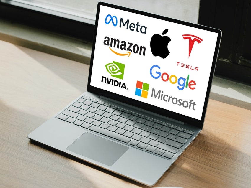 Magnificent Seven, 7 tech companies stocks, logos displayed on laptop computer screen