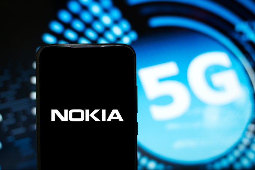 Nokia logo displayed on a smartphone with the 5G as a background
