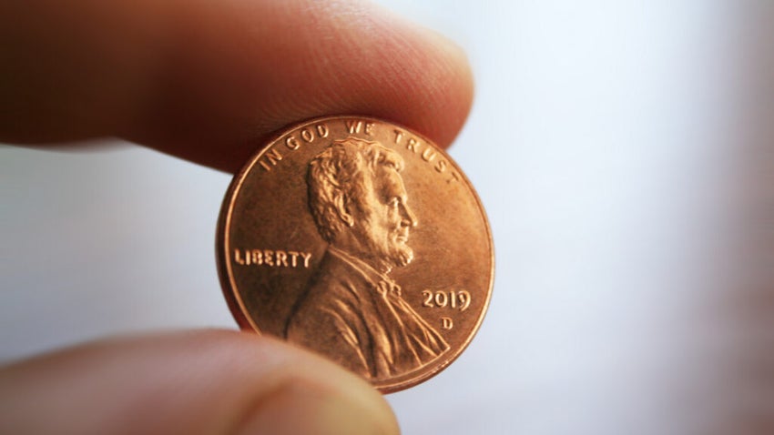 2019 Penny In Fingers Close Up