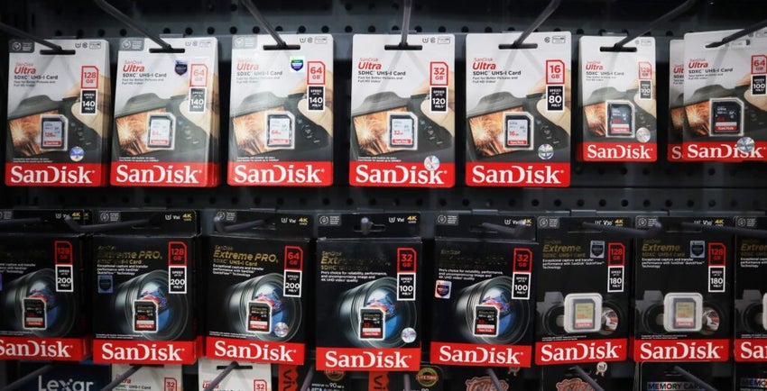 Pacitan, Indonesia - March 20, 2025 : Shelves filled with neatly packaged SanDisk memory cards in a store in Pacitan city. Focusing on technology and storage solutions.