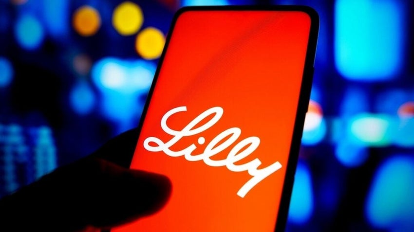 Eli Lilly logo on smartphone against a multi-colored background